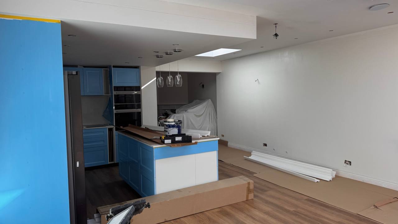 MALCON rear extension in Chelmsford: kitchen island and tall units during final fit-out